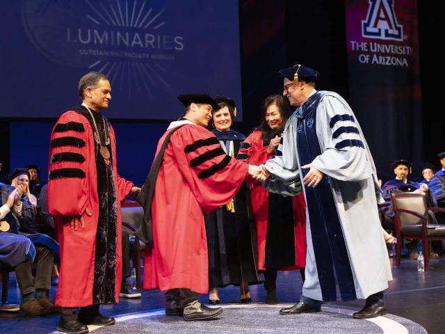 Awardee-Jiang-Wu-and-Dean-A-P-Durand-shake-hands-while-President-Garimella-Provost-Prelock-Regent-Cecilia-Mata