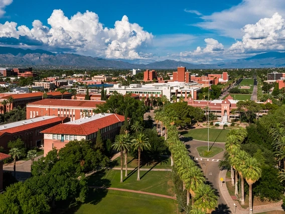 old main under blue skies with clouds